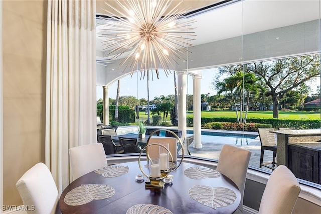 sunroom with a notable chandelier