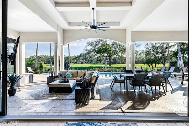 view of patio with an outdoor living space and ceiling fan