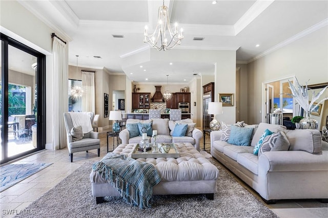 living room with a tray ceiling, crown molding, and a chandelier