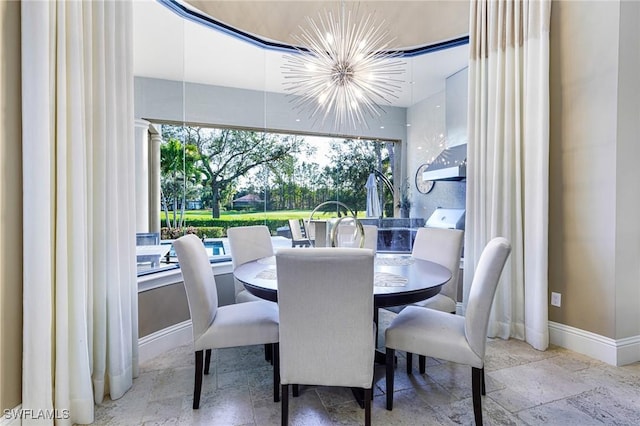 dining room with a notable chandelier