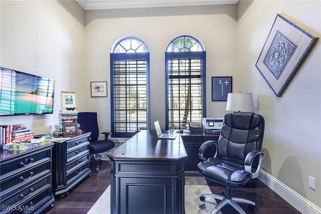 office space featuring dark hardwood / wood-style floors, crown molding, and a healthy amount of sunlight