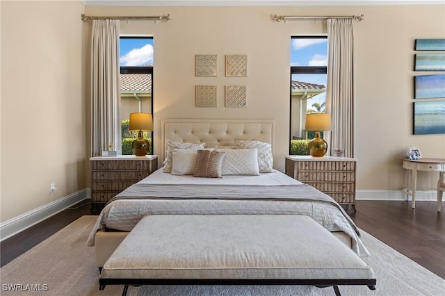 bedroom with dark wood-type flooring