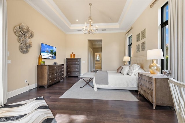 bedroom featuring a chandelier, crown molding, dark wood-type flooring, and a tray ceiling