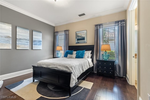 bedroom with dark wood-type flooring and ornamental molding