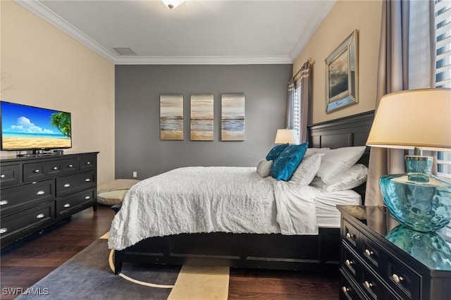 bedroom featuring dark hardwood / wood-style flooring and ornamental molding