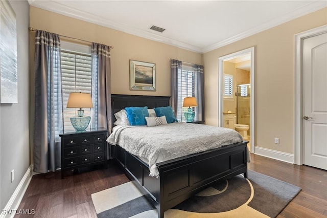 bedroom with connected bathroom, dark hardwood / wood-style flooring, and ornamental molding