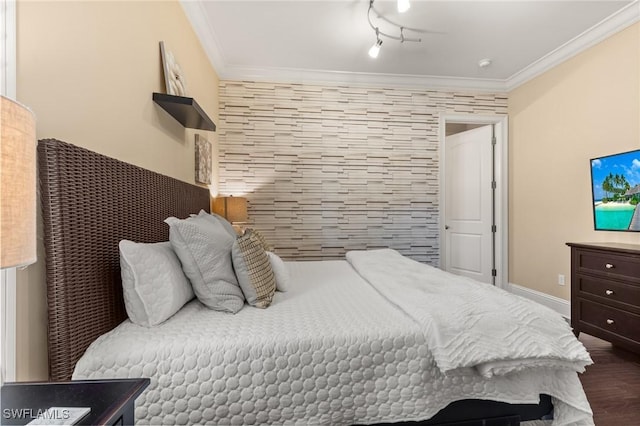 bedroom featuring crown molding and wood-type flooring