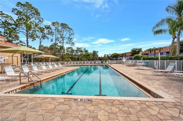 view of swimming pool featuring a patio area