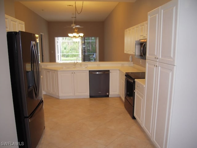 kitchen with white cabinetry, sink, hanging light fixtures, a notable chandelier, and appliances with stainless steel finishes