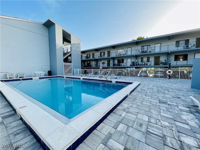 view of swimming pool with a patio