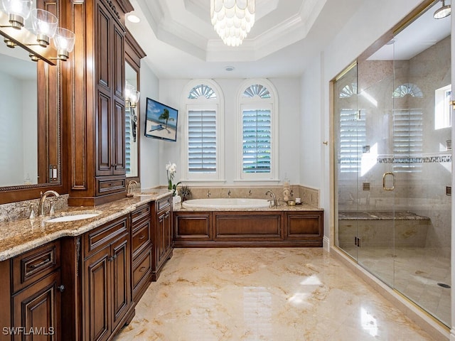 full bath featuring a tray ceiling, a stall shower, ornamental molding, a garden tub, and a notable chandelier