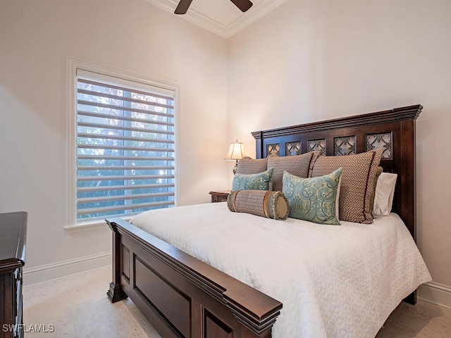 bedroom with a ceiling fan, baseboards, and ornamental molding