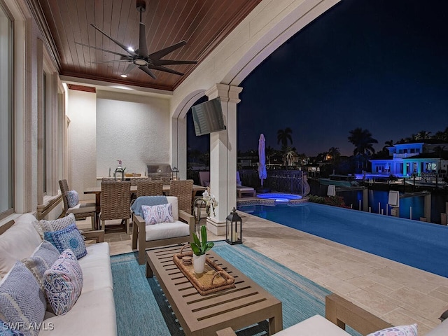 view of patio with an in ground hot tub, an outdoor pool, an outdoor hangout area, and ceiling fan