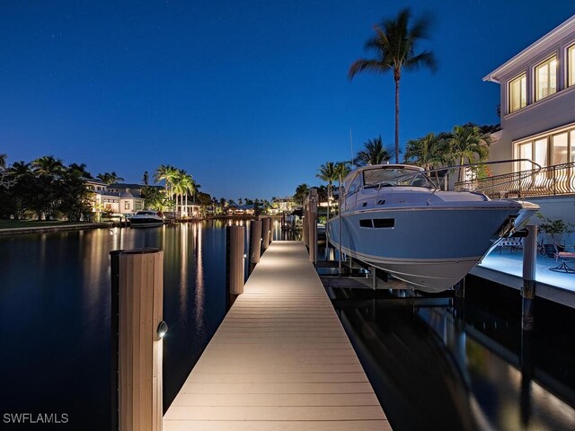 view of dock with a water view and boat lift