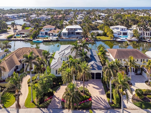 bird's eye view with a residential view and a water view