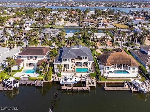 bird's eye view featuring a residential view and a water view