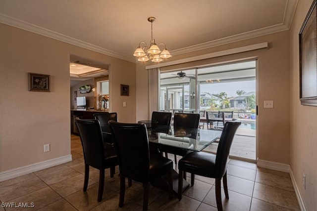 dining room with crown molding, ceiling fan with notable chandelier, and tile patterned floors