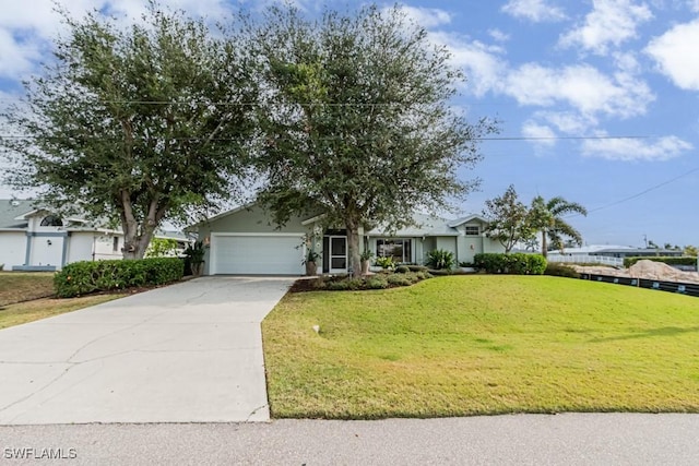 view of front of property with a garage and a front lawn