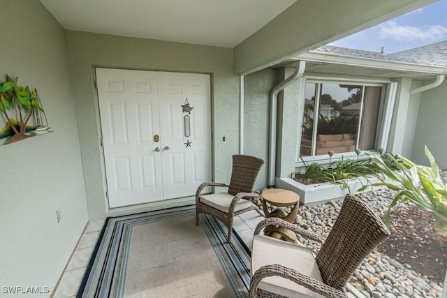 property entrance featuring a balcony