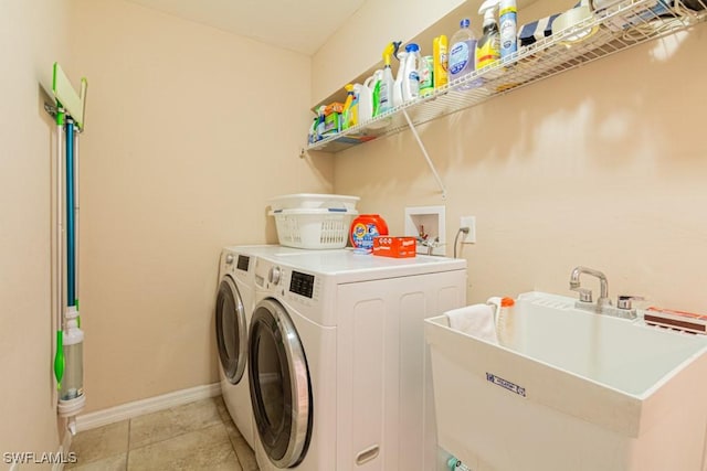 washroom featuring sink and separate washer and dryer