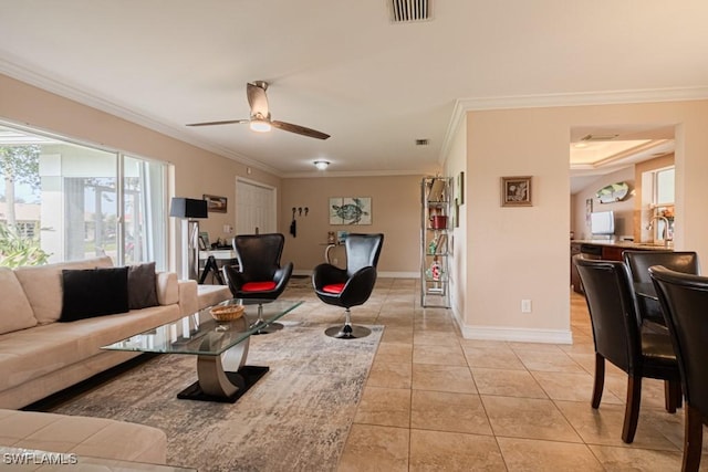 living room with crown molding, sink, light tile patterned floors, and ceiling fan