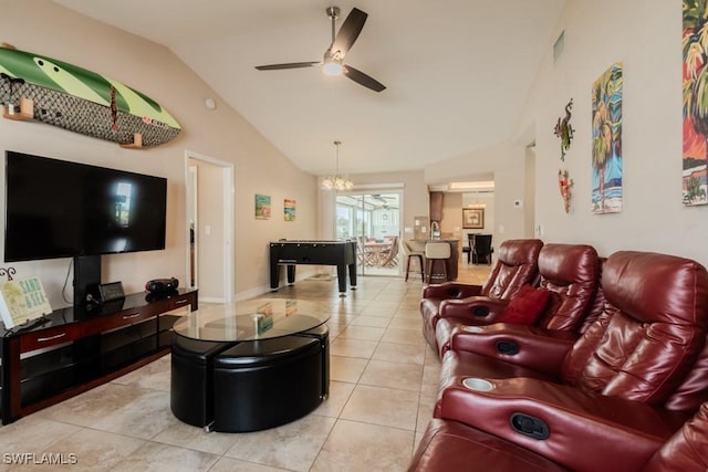 tiled living room with ceiling fan with notable chandelier and vaulted ceiling