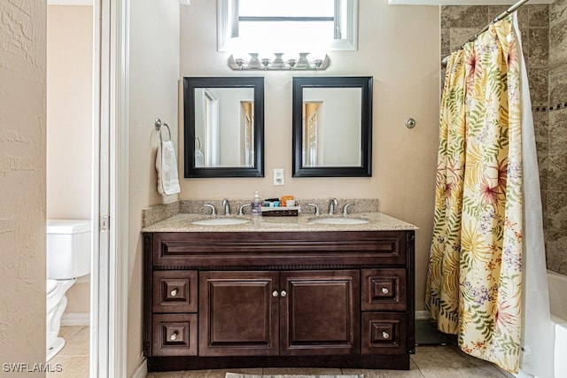 full bathroom with shower / bath combo, toilet, tile patterned floors, and vanity