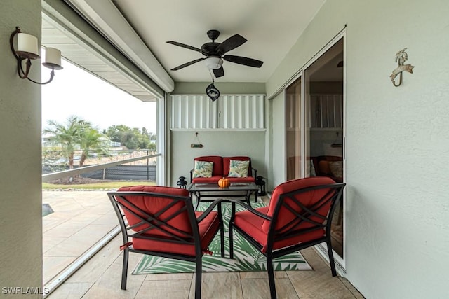 sunroom / solarium with ceiling fan