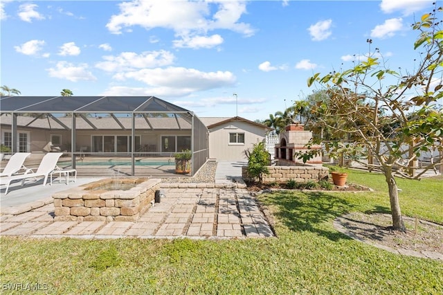 back of property featuring a lanai, a patio, and a yard