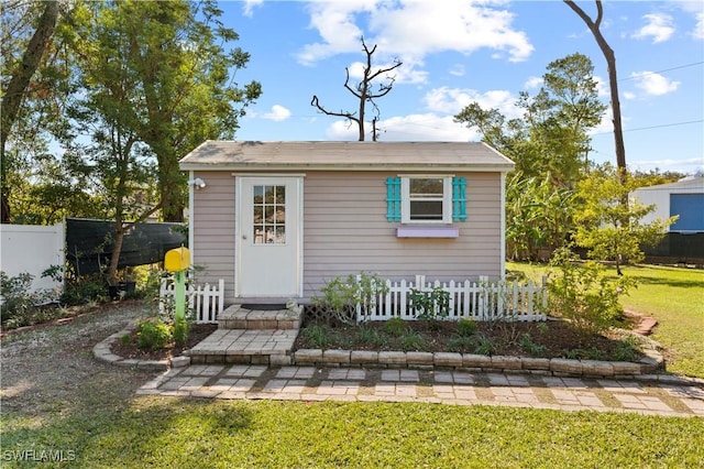 view of outdoor structure with a lawn