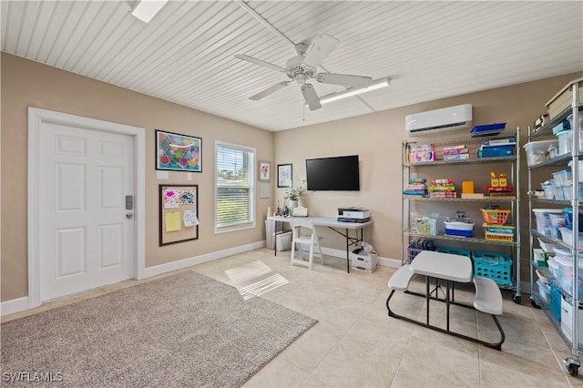 office space with a wall unit AC, ceiling fan, and light tile patterned floors