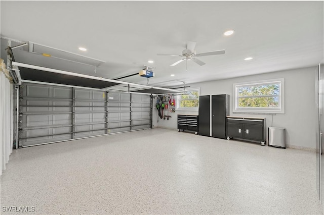 garage featuring a garage door opener and ceiling fan