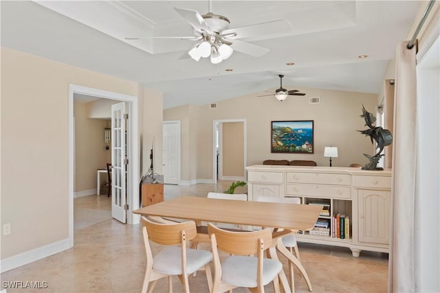 dining room featuring french doors, light tile patterned flooring, and vaulted ceiling