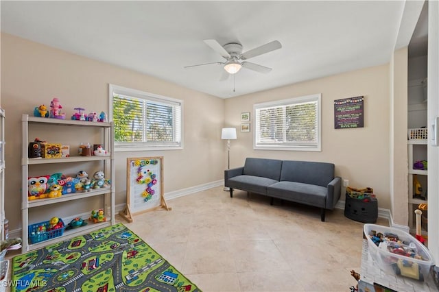 rec room featuring ceiling fan and light tile patterned floors