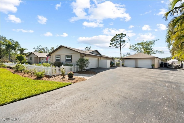 ranch-style house featuring a garage