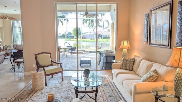 tiled living room featuring ceiling fan