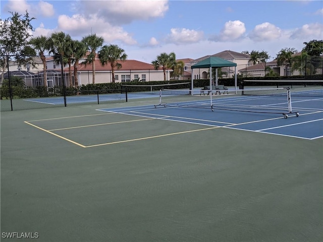 view of sport court with basketball hoop