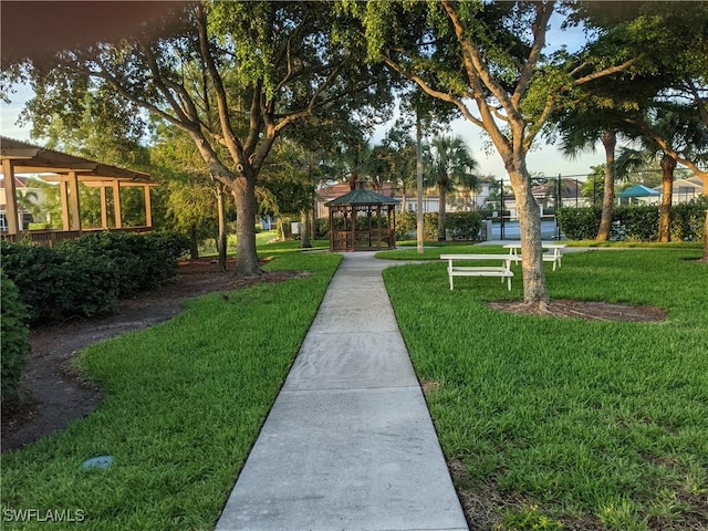 view of home's community with a gazebo and a yard