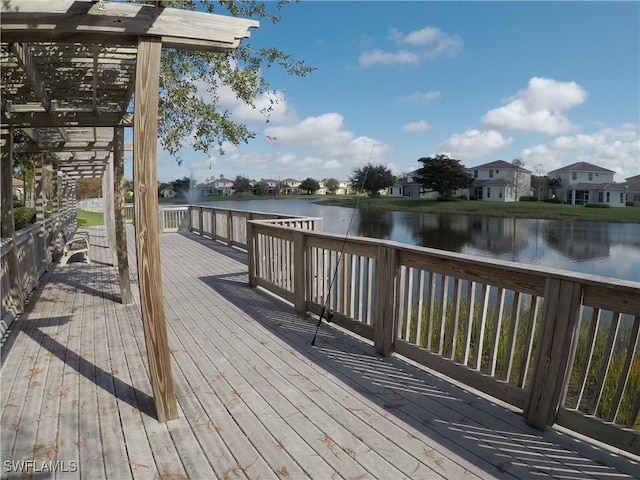 dock area featuring a deck with water view