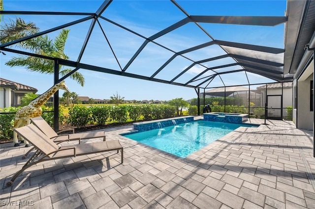 view of pool featuring a lanai, a patio, pool water feature, and an in ground hot tub