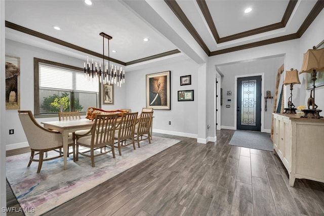 dining area with a chandelier and ornamental molding