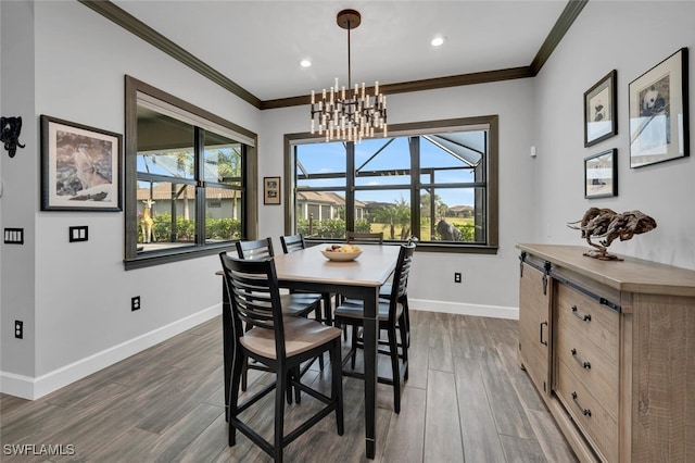 dining room featuring ornamental molding, dark wood-type flooring, and a notable chandelier