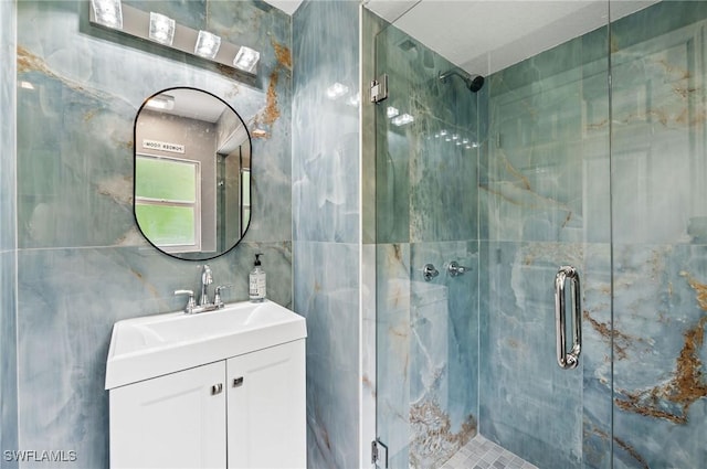 bathroom with vanity and walk in shower