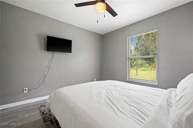 bedroom with ceiling fan and hardwood / wood-style floors