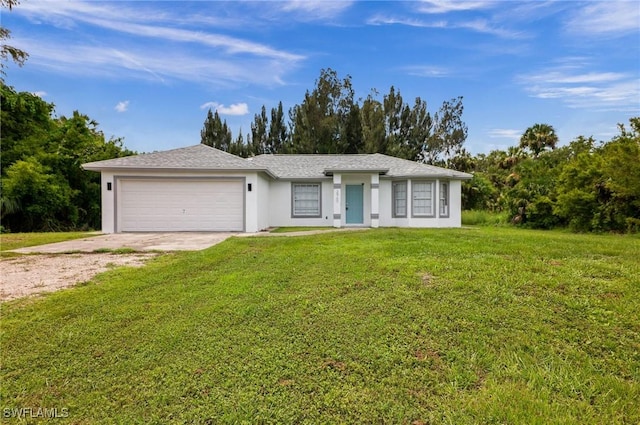 single story home with a garage and a front lawn