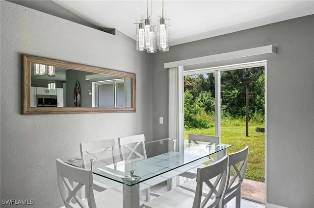 dining area with lofted ceiling