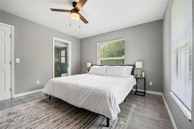 bedroom with ceiling fan and ensuite bathroom