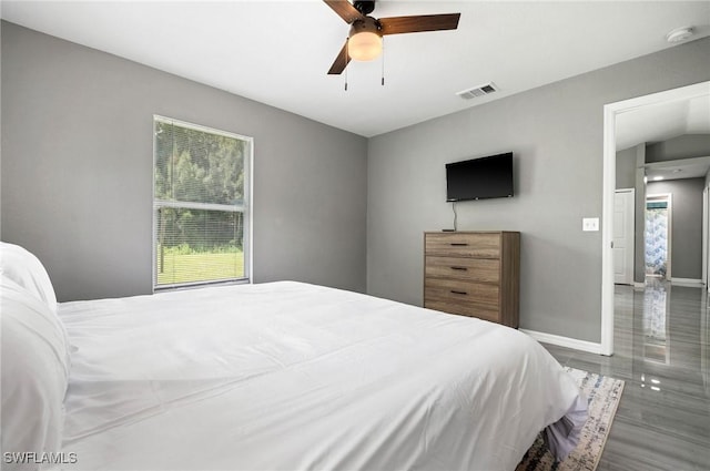 bedroom featuring ceiling fan and dark wood-type flooring