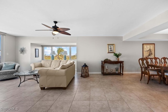 living room with ceiling fan and light tile patterned floors