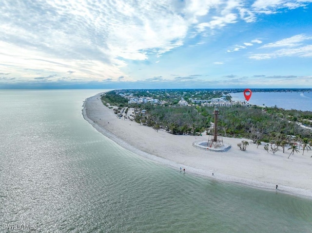 bird's eye view with a water view and a beach view